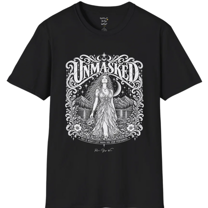 A short sleeved tee called the Unmasked T-Shirt, flat lay and a soft cotton shirt. Simply says, Unmasked. Design highlights an ornate floral crest in white linework with a long-haired figure in a flowing gown beneath a crescent moon, with Unmasked in ornate lettering across the top. Color is Black.
