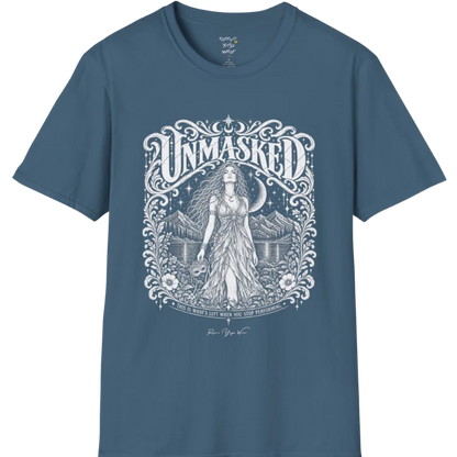 A short sleeved tee called the Unmasked T-Shirt, flat lay and a soft cotton shirt. Simply says, Unmasked. Design highlights an ornate floral crest in white linework with a long-haired figure in a flowing gown beneath a crescent moon, with Unmasked in ornate lettering across the top. Color is Indigo Blue.