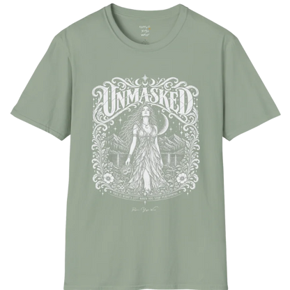 A short sleeved tee called the Unmasked T-Shirt, flat lay and a soft cotton shirt. Simply says, Unmasked. Design highlights an ornate floral crest in white linework with a long-haired figure in a flowing gown beneath a crescent moon, with Unmasked in ornate lettering across the top. Color is Sage.