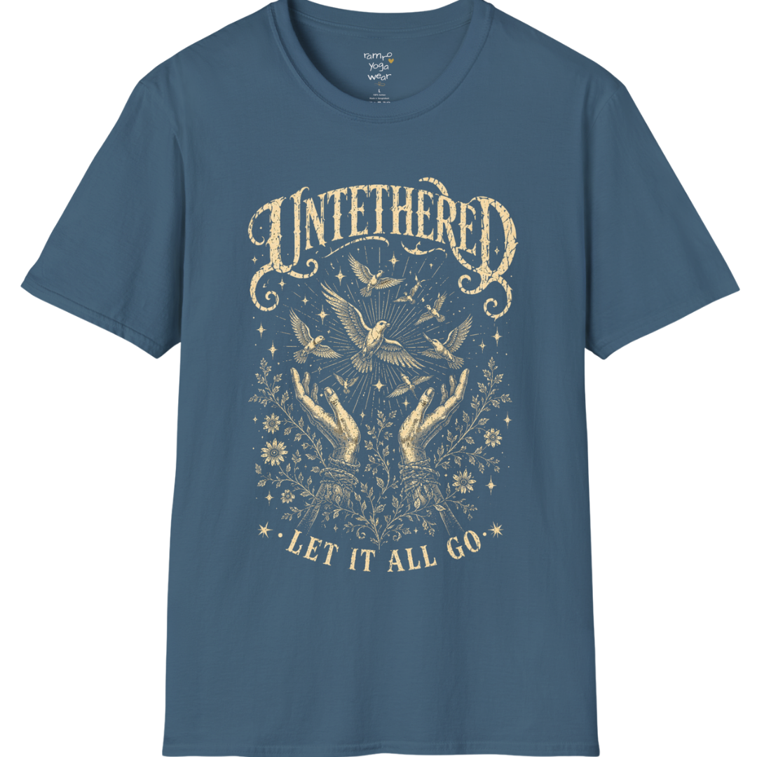 Indigo Blue Untethered T-Shirt with distressed oatmeal mystical graphic and celestial bird artwork inspired by freedom, stillness, and soulful expression.