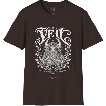 A short sleeved Tee, illustrated with a face partially obscured behind sheer draped fabric, a crescent moon behind, fine botanical framing at the base. Veil T-Shirt flat lay is a Gildan 64000 and the color is Dark Chocolate.
