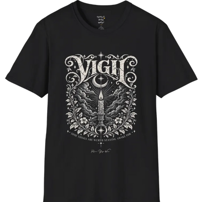 Short sleeved tee, illustration of a single candle burning steady against stormy clouds and wind lines, flame untouched, fine botanical framing at the base. Vigil T-Shirt flat lay is a Gildan 64000 and the color is Black.