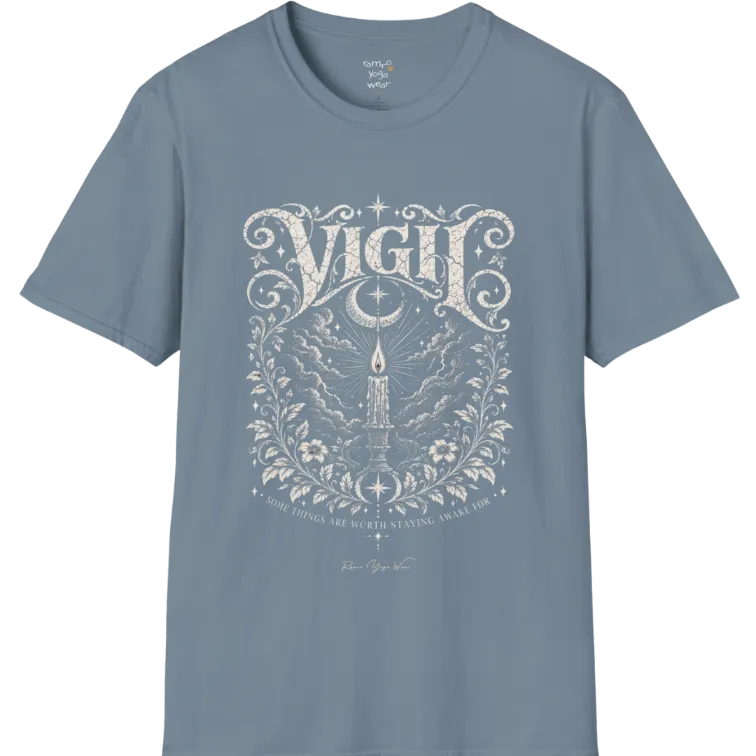 Short sleeved tee, illustration of a single candle burning steady against stormy clouds and wind lines, flame untouched, fine botanical framing at the base. Vigil T-Shirt flat lay is a Gildan 64000 and the color is Stone Blue.