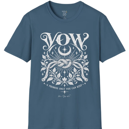A short sleeved tee, illustrated with a single tied knot emblem and a crescent moon above, framed by fine botanical detailing. Vow T-Shirt flat lay is a Gildan 64000 and the color is Indigo Blue