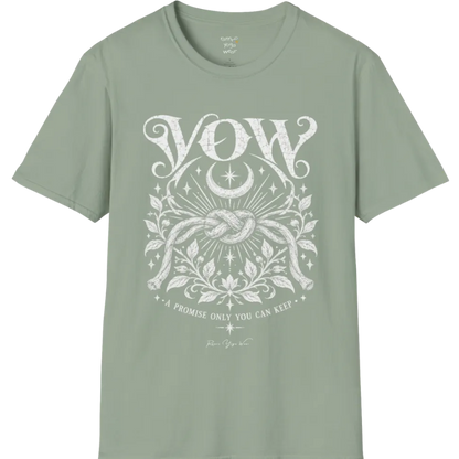A short sleeved tee, illustrated with a single tied knot emblem and a crescent moon above, framed by fine botanical detailing. Vow T-Shirt flat lay is a Gildan 64000 and the color is Sage.