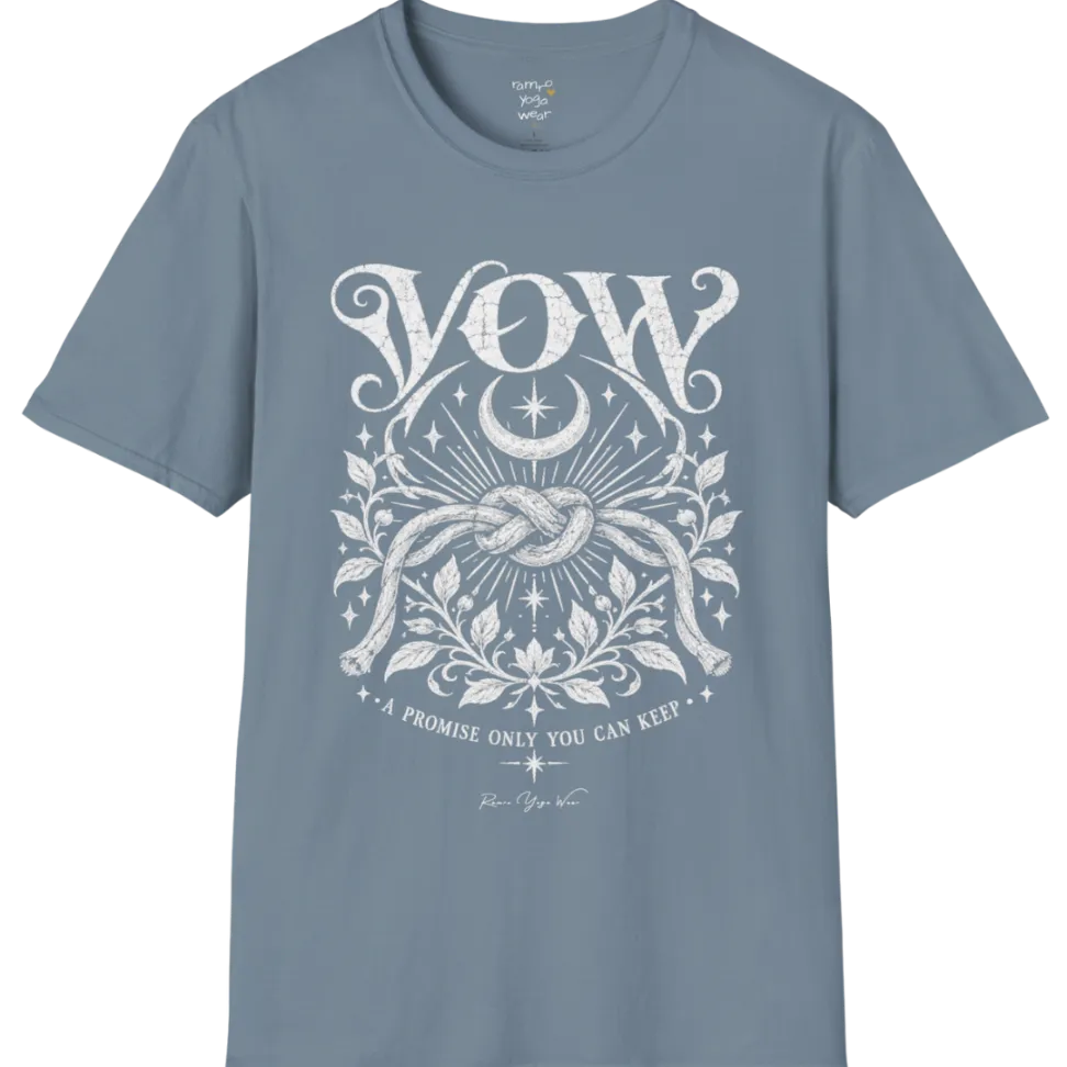 A short sleeved tee, illustrated with a single tied knot emblem and a crescent moon above, framed by fine botanical detailing. Vow T-Shirt flat lay is a Gildan 64000 and the color is Stone Blue.