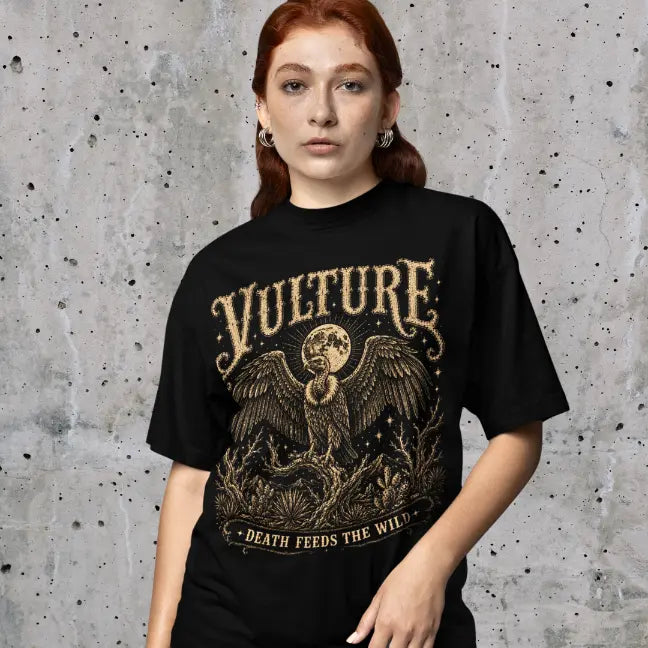 Woman wearing Vulture T-Shirt against a concrete wall backdrop, shirt in Black.