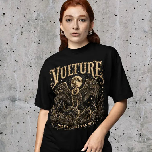 Woman wearing Vulture T-Shirt against a concrete wall backdrop, shirt in Black.