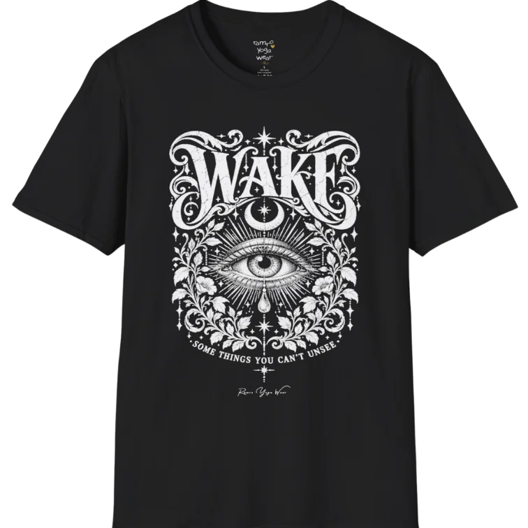 A short sleeved tee with an illustration of a single open eye amid darkness with a dewdrop caught mid-fall beneath it, faint stars scattered around, fine botanical framing at the base. Wake T-Shirt flat lay is a Gildan 64000 and the color is Black.