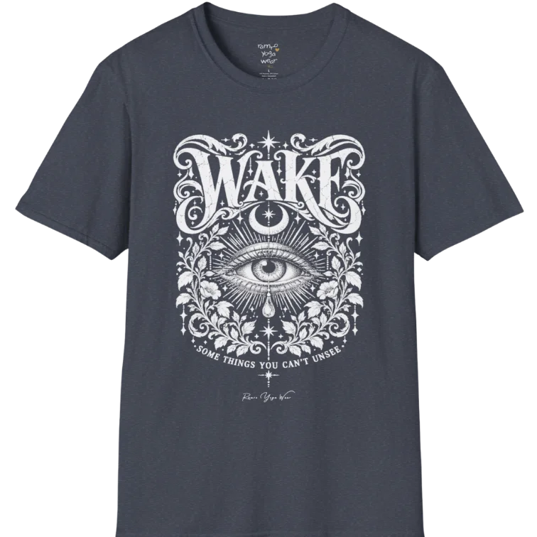 A short sleeved tee with an illustration of a single open eye amid darkness with a dewdrop caught mid-fall beneath it, faint stars scattered around, fine botanical framing at the base. Wake T-Shirt flat lay is a Gildan 64000 and the color is Heather Navy.