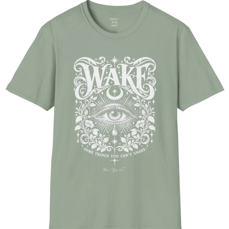 A short sleeved tee with an illustration of a single open eye amid darkness with a dewdrop caught mid-fall beneath it, faint stars scattered around, fine botanical framing at the base. Wake T-Shirt flat lay is a Gildan 64000 and the color is Sage.