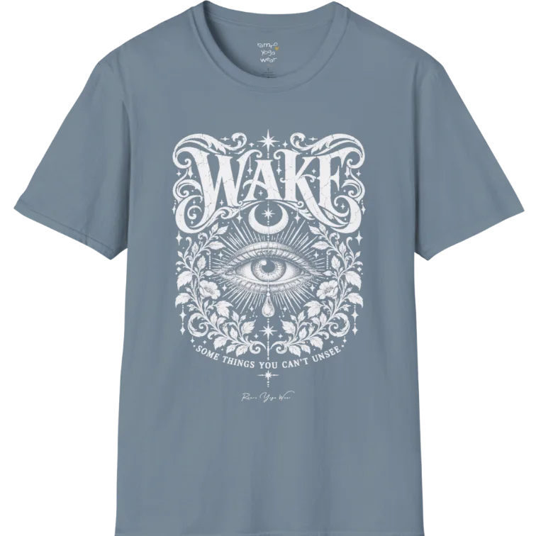 A short sleeved tee with an illustration of a single open eye amid darkness with a dewdrop caught mid-fall beneath it, faint stars scattered around, fine botanical framing at the base. Wake T-Shirt flat lay is a Gildan 64000 and the color is Stone Blue.