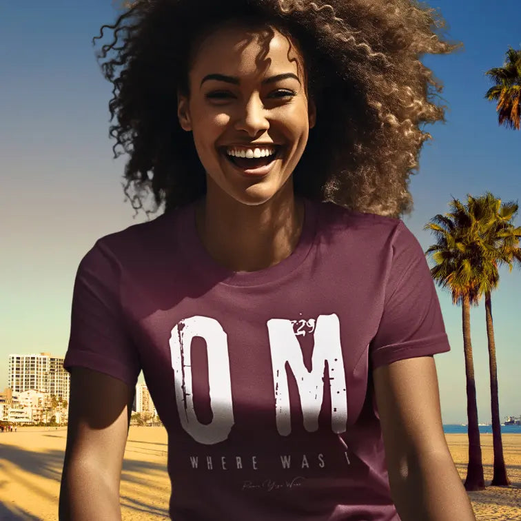 Person wearing Where Was I Heather Cardinal color sacred yoga shirt laughing at the beach with palm trees — Funny Yoga Shirts collection by Ramro Yoga Wear