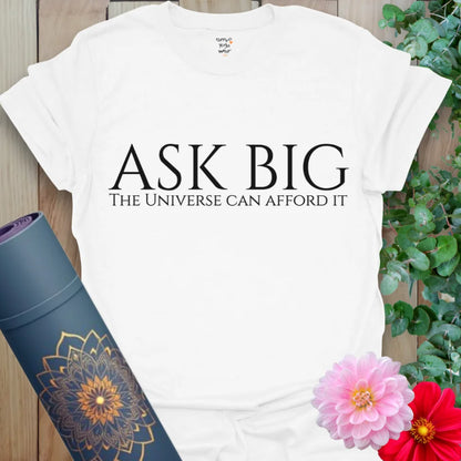 Crisp white yoga t-shirt with “Ask Big” quote, blending mindful intention with minimalist design.