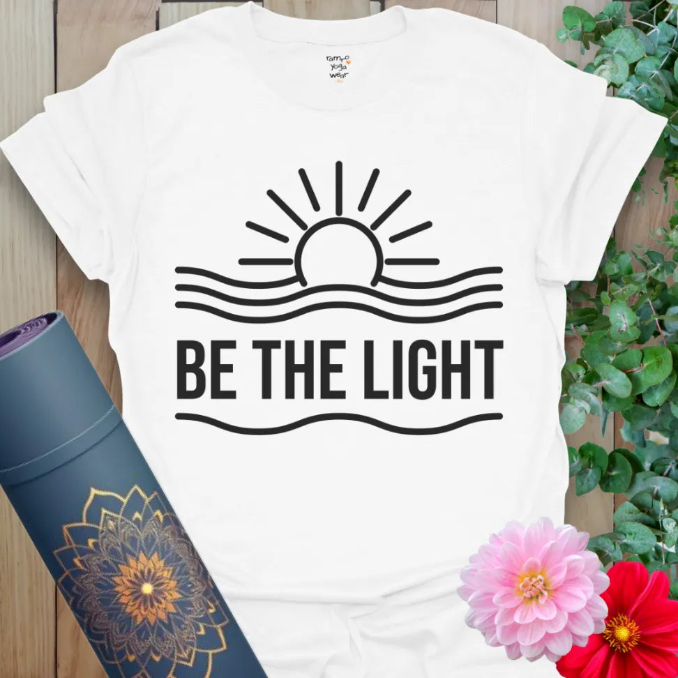 White cotton t-shirt with bold sun rays and empowering Be the Light message.