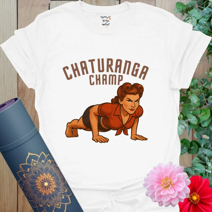 White cotton yoga tee with vintage-style yogi in chaturanga pose and bold “Chaturanga Champ” text.