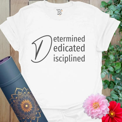 White Determined T-Shirt featuring “Determined, Dedicated, Disciplined” mantra in elegant black text. A clean and bold look for purposeful yogis.
