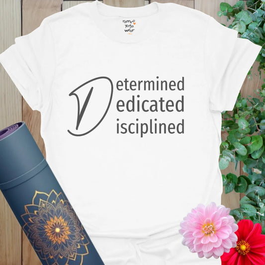 White Determined T-Shirt featuring “Determined, Dedicated, Disciplined” mantra in elegant black text. A clean and bold look for purposeful yogis.