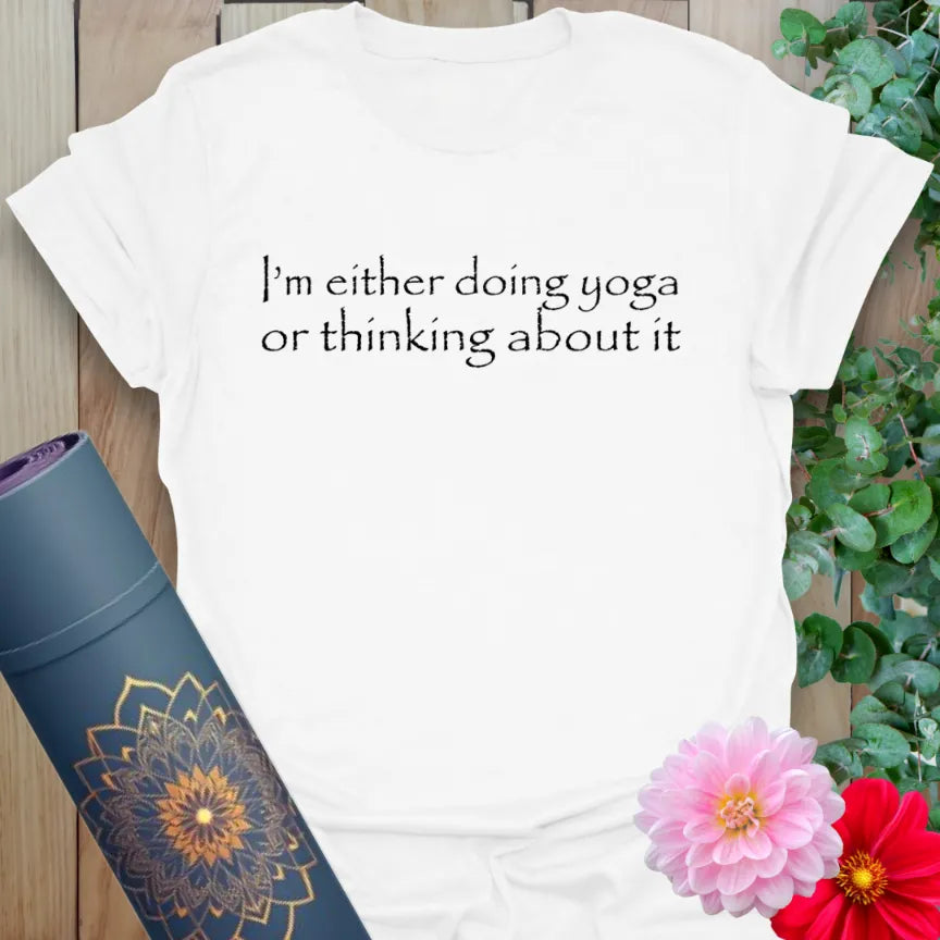 White Doing Yoga T-Shirt featuring playful yoga lifestyle affirmation in modern text