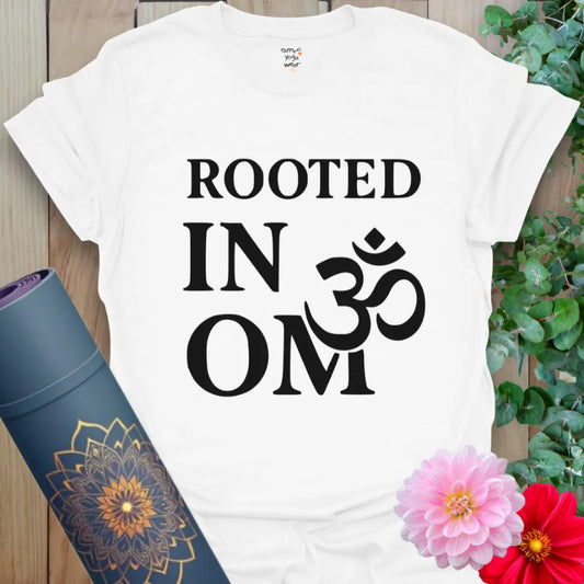 White Earth & OM T-Shirt featuring minimalist "Rooted in OM" message in powerful black typography