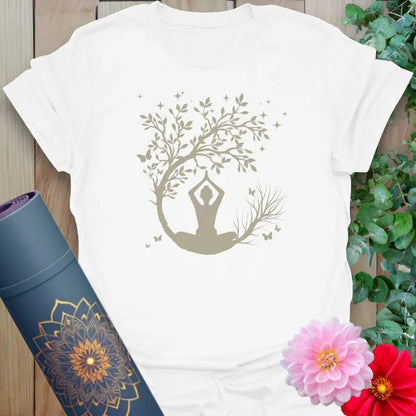 Clean white unisex yoga t-shirt featuring peaceful meditation scene with tree of life and moon for soulful living.