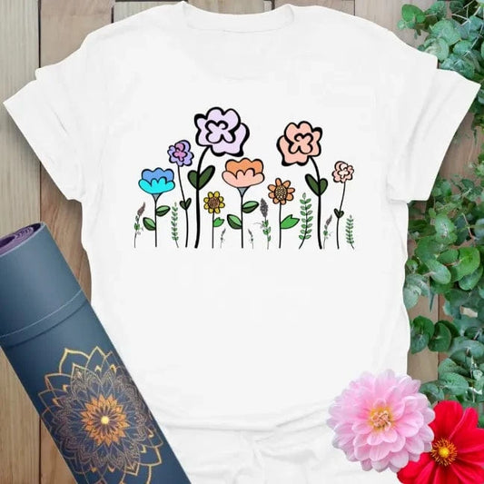 Clean white unisex yoga t-shirt showcasing colorful wildflower artwork for free-spirited, mindful living