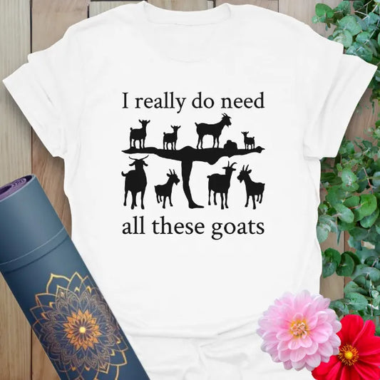 Clean white unisex yoga t-shirt showcasing fun goat yoga illustration and playful quote for soulful, animal-loving adventurers.