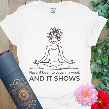White It Shows T-Shirt featuring a messy-haired yogi in meditation pose. Funny yoga shirt for everyday wear and self-aware calm.