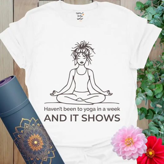 White It Shows T-Shirt featuring a messy-haired yogi in meditation pose. Funny yoga shirt for everyday wear and self-aware calm.