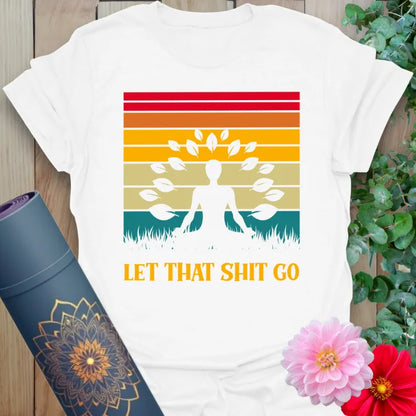 Clean white unisex yoga t-shirt featuring meditative silhouette and "Let That Sh*t Go" playful message for mindful freedom.