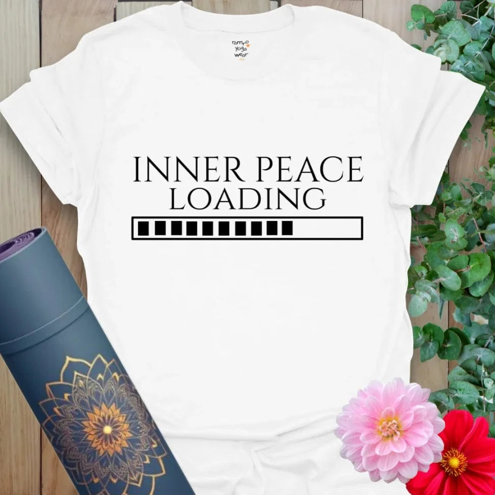Crisp white yoga tee with centered “INNER PEACE LOADING” design, made for meditation, mindfulness, and everyday calm.