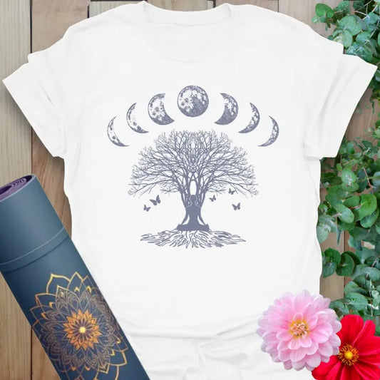 Clean white unisex yoga t-shirt featuring majestic tree, moon cycle, and butterfly design celebrating mindful growth and cosmic balance.