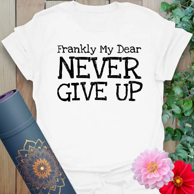 Clean white unisex yoga t-shirt featuring inspiring "Never Give Up" quote for conscious, empowered daily movement.