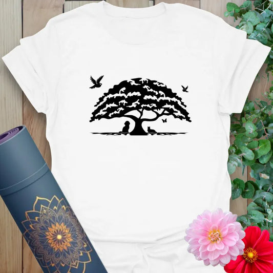 Clean white unisex yoga t-shirt featuring majestic oak tree and bird design inspiring nature-connected mindfulness and inner strength.