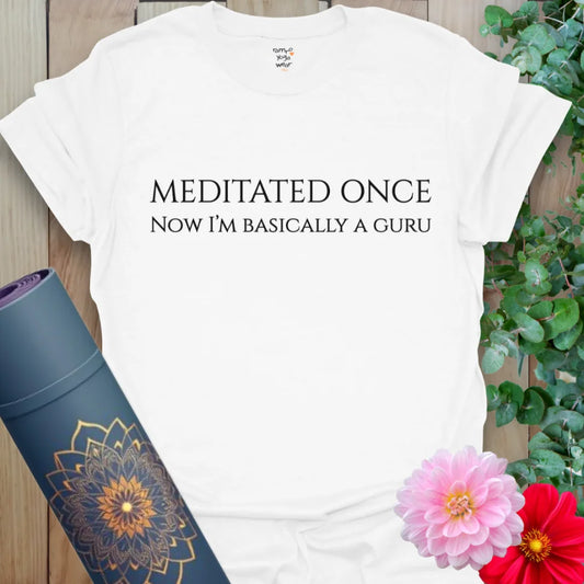 Crisp white t-shirt with minimalist “Meditated Once, Now I’m Basically a Guru” typography for lighthearted spiritual vibes.