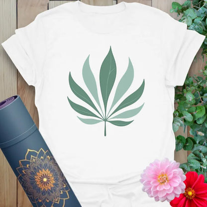 Clean white unisex yoga t-shirt featuring minimalist palm leaf artwork for conscious, nature-connected mindful living.