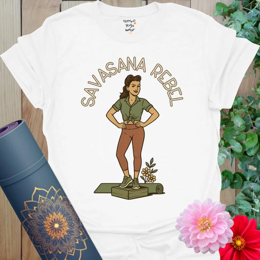 Crisp white cotton yoga tee with a bold retro yogi design standing proudly on a mat with floral detail.