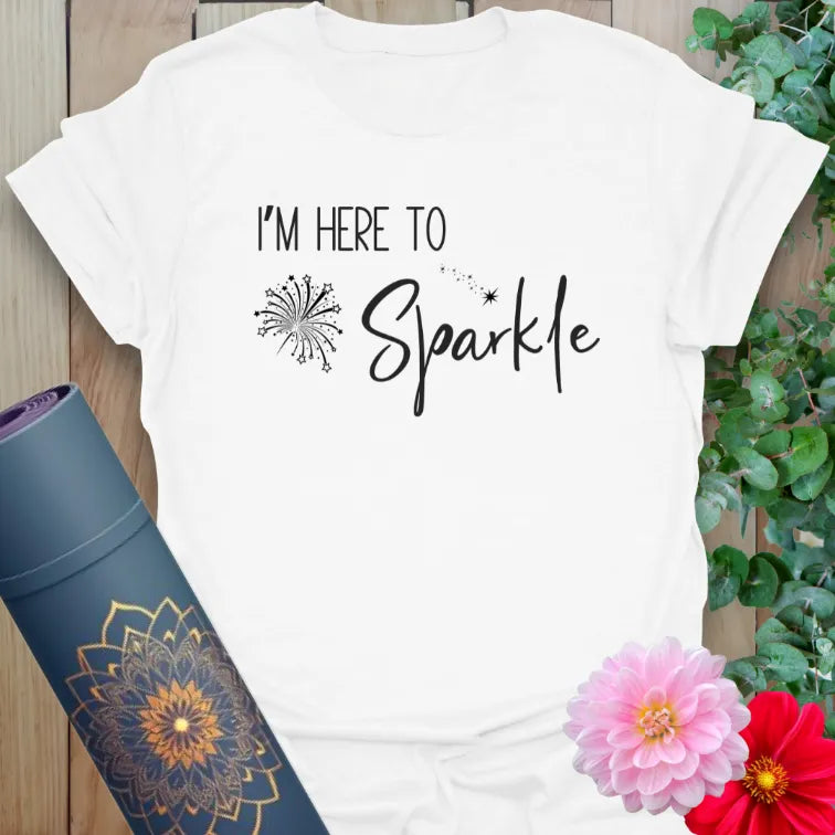 Clean white unisex yoga t-shirt with minimalist sparkle artwork inspiring joy, light, and positive energy.
