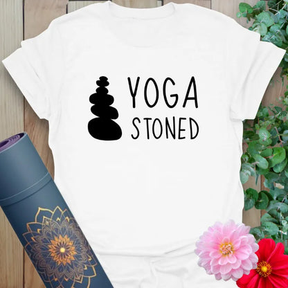 Clean white unisex yoga tee with minimalist rock tower and cheeky “YOGA STONED” text, perfect for peaceful pun lovers.