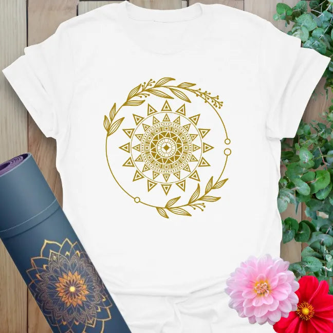 Clean white unisex tee with celestial mandala-style sun and leafy accents, perfect for conscious, radiant expression.