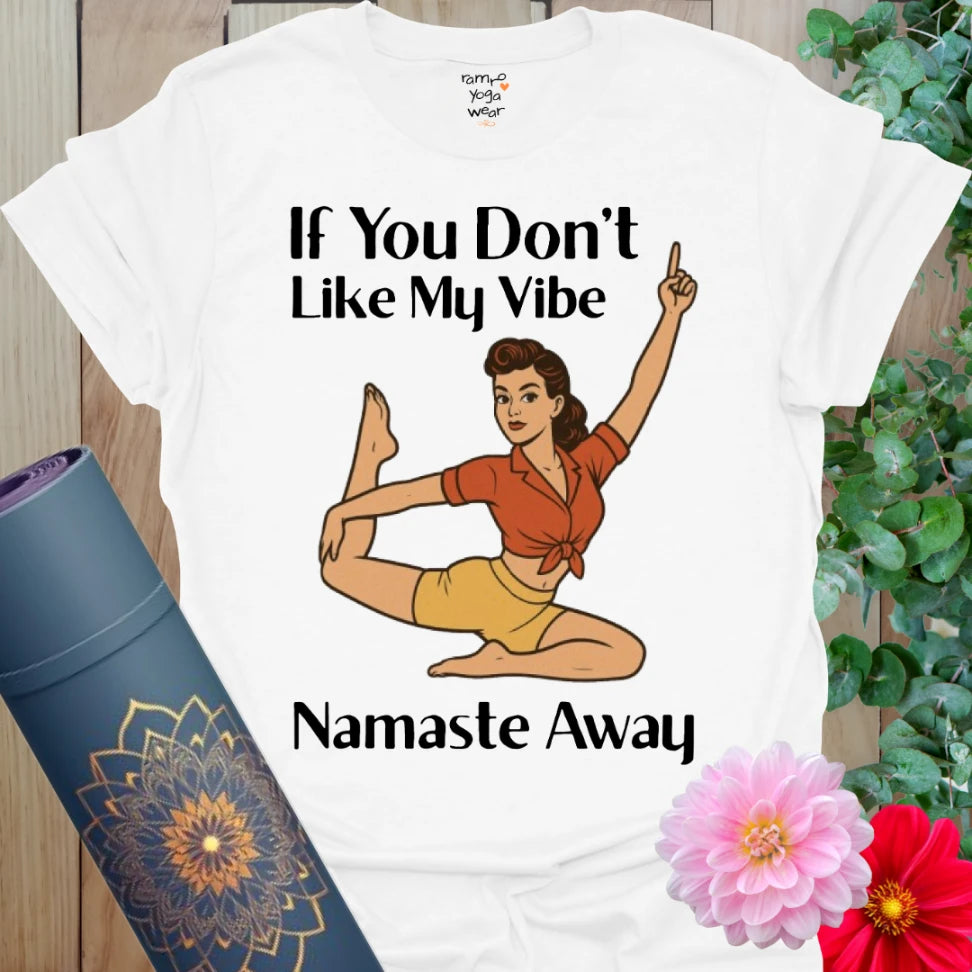 Clean white yoga t-shirt with bold pinup yogi in dancer pose and “Namaste Away” message for conscious confidence.
