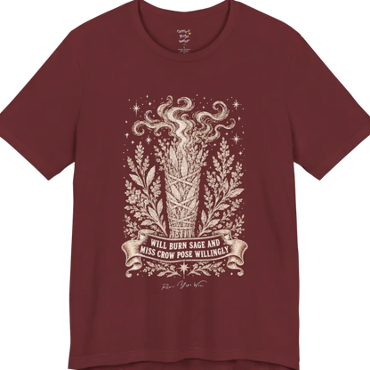 A short sleeved tee illustrating a bundled sage smudge stick with smoke and botanical framing, "Will Burn Sage And Miss Crow Pose Willingly" banner design — Funny Yoga Shirts collection by Ramro Yoga Wear in Heather Cardinal.
