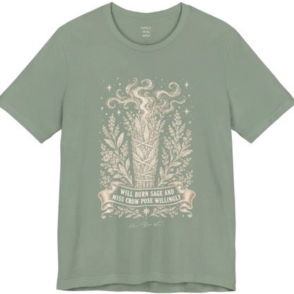 A short sleeved tee illustrating a bundled sage smudge stick with smoke and botanical framing, "Will Burn Sage And Miss Crow Pose Willingly" banner design — Funny Yoga Shirts collection by Ramro Yoga Wear in Sage.