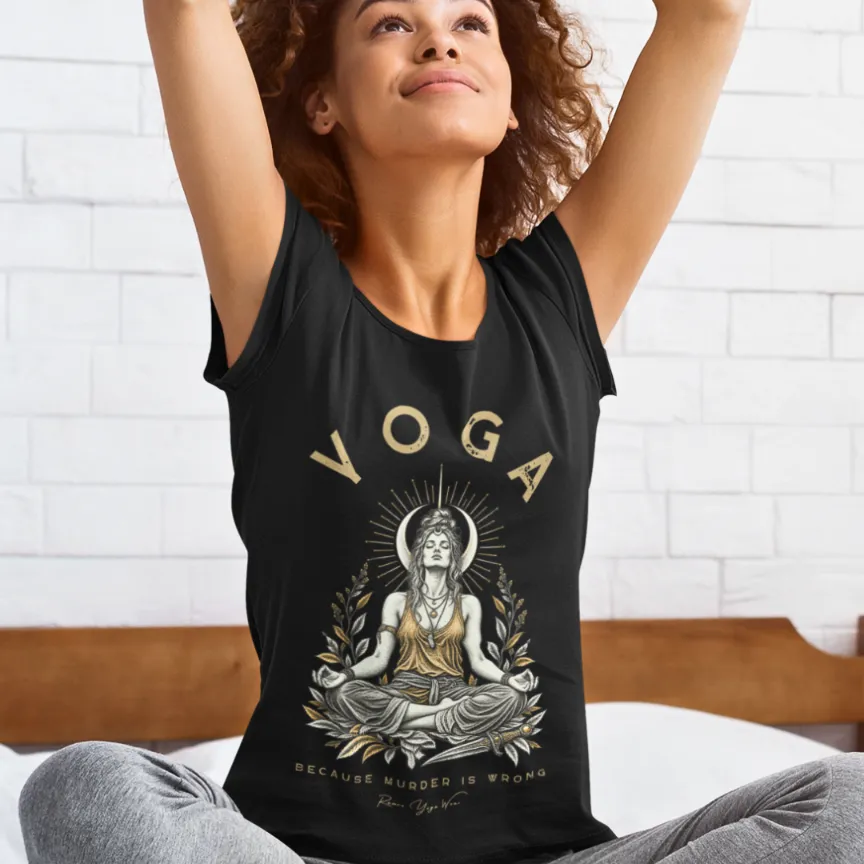 A woman stretches with her arms raised overhead in a bedroom setting, wearing the Wrong T-Shirt. Wrong T-Shirt is a Bella+Canvas 3001 and the color is Black.