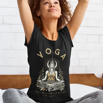 A woman stretches with her arms raised overhead in a bedroom setting, wearing the Wrong T-Shirt. Wrong T-Shirt is a Bella+Canvas 3001 and the color is Black.